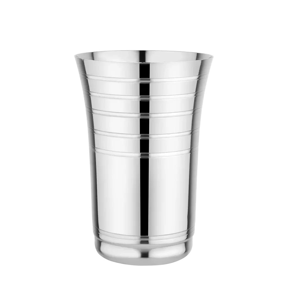 Stainless steel tumbler with grooved design, kitchen utensils, isolated on white background